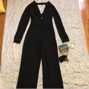 Bebe Black long sleeve jumpsuit size 00